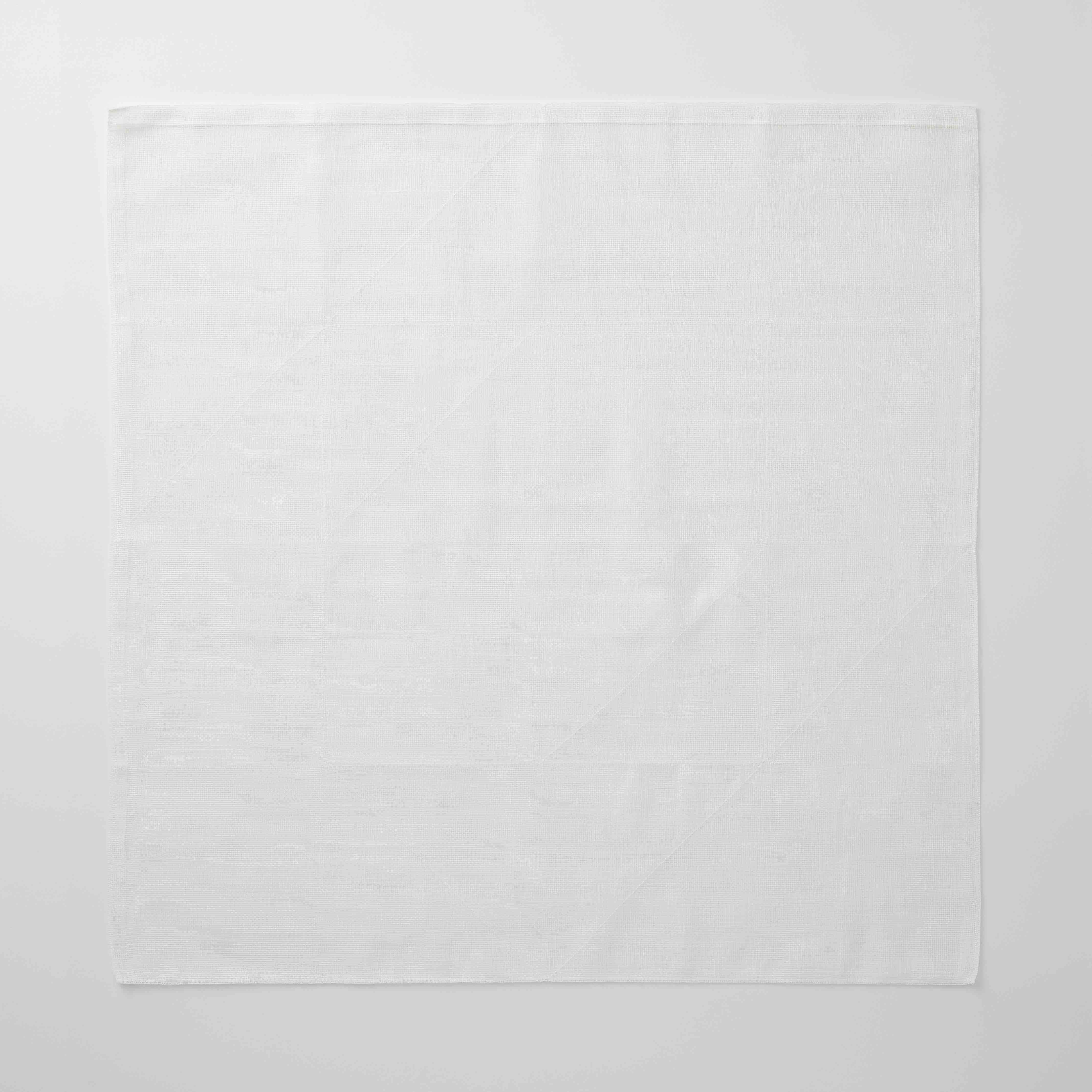 White tea towel on a white back ground