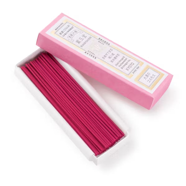 Pink incense sticks with packaging on a white background