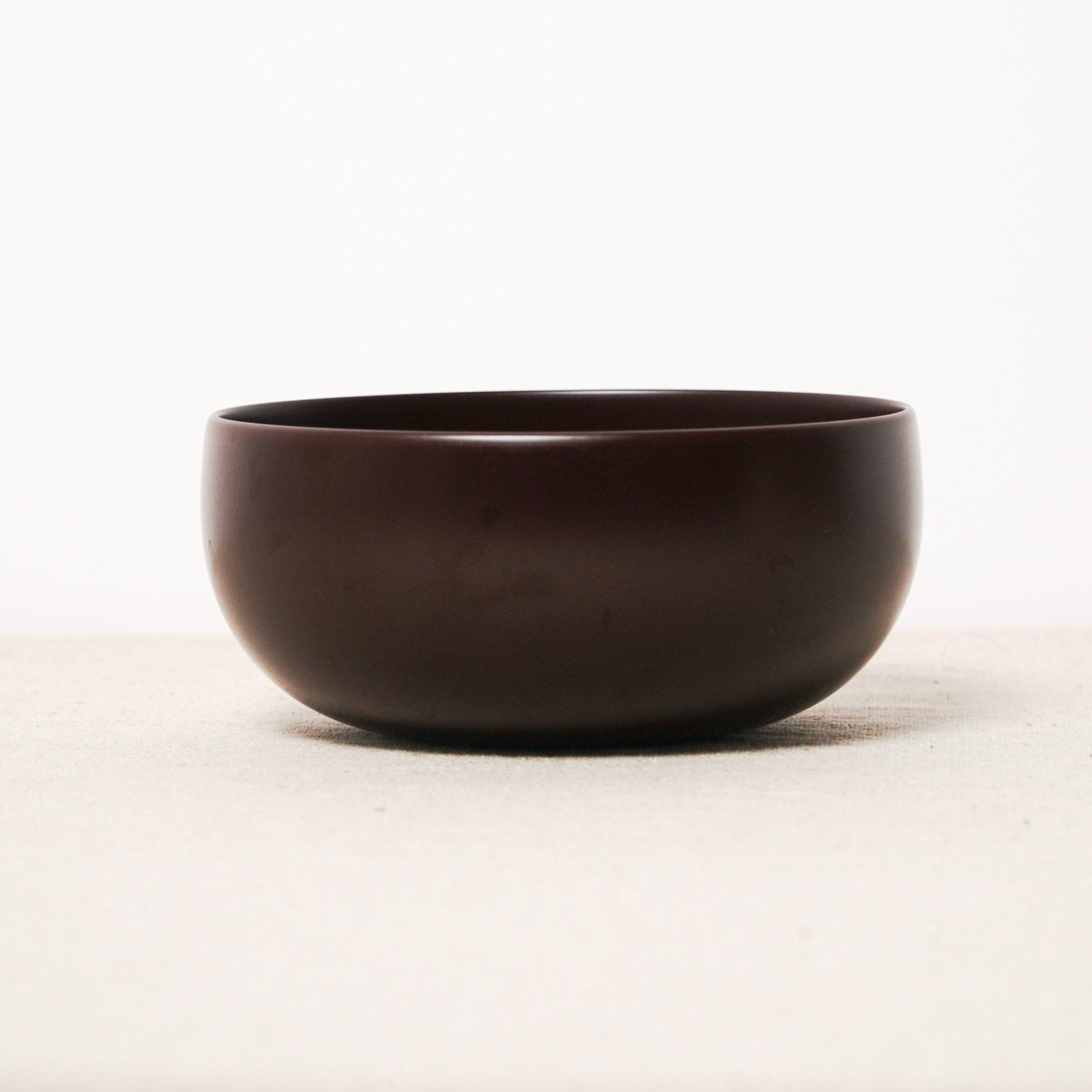 Black ceramic bowl on a white background