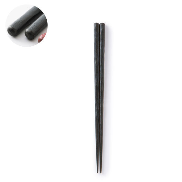 Pair of black chopsticks on a white background