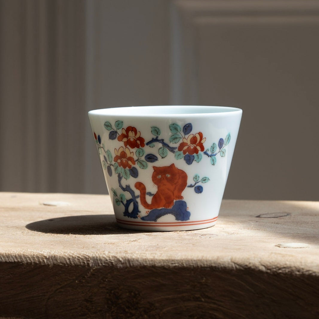 Barabar Iroe soba choko cup - small white ceramic cup with a colorful floral and cat illustration in Hasami porcelain.