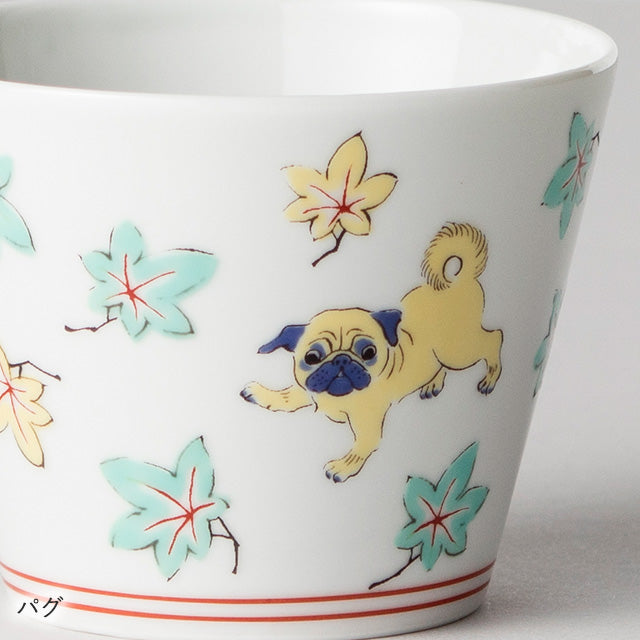 Ceramic cup with pug dog design and floral patterns on a white background