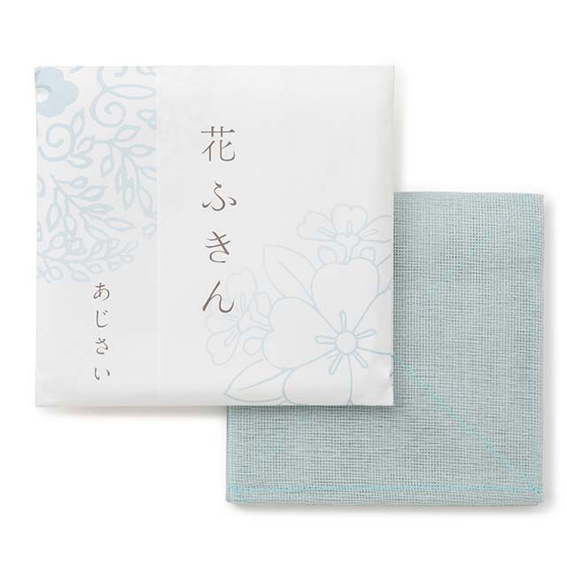 Japanese towel package with floral patterns and text and a light blue towel  on a white background