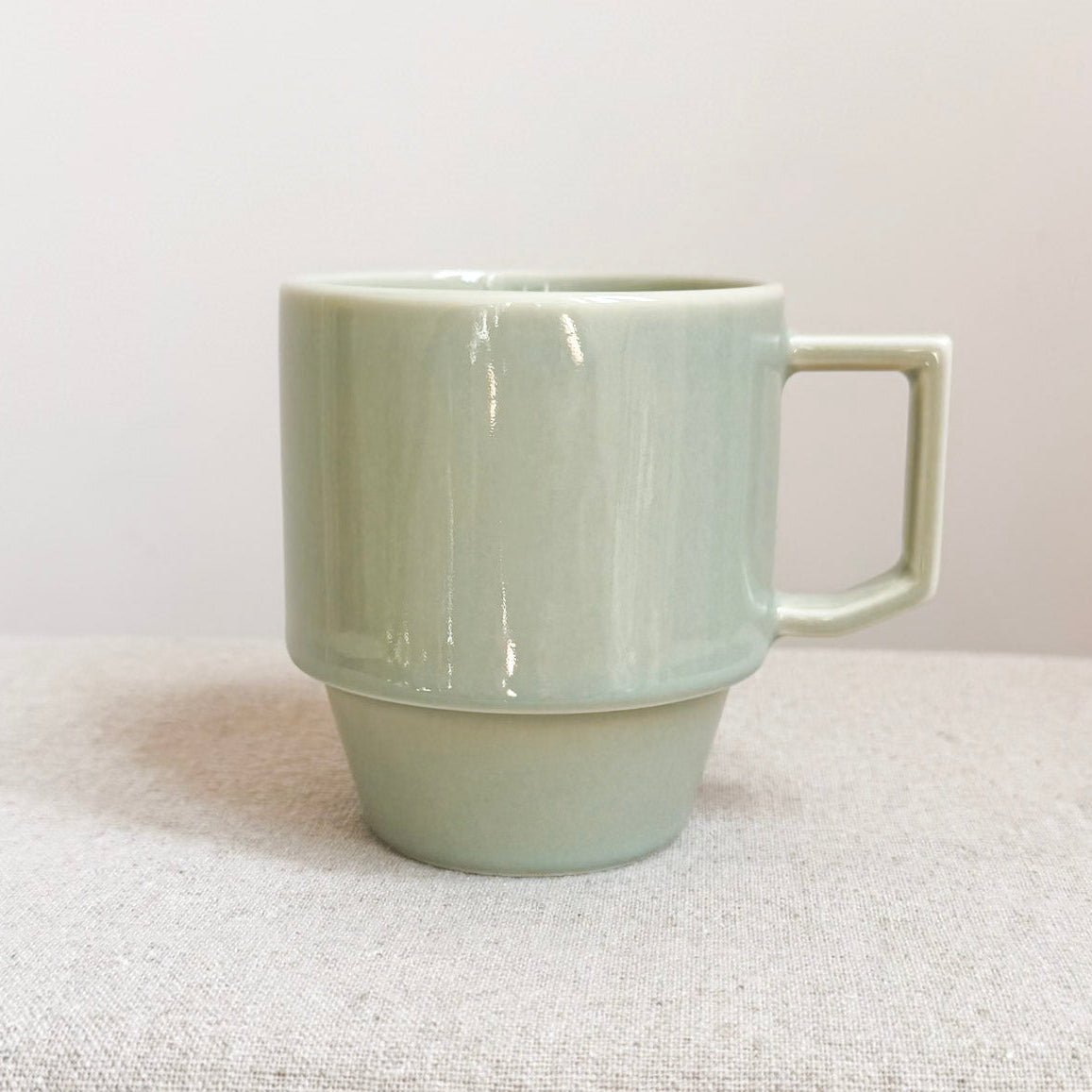 A pale mint Hasami Block Mug with a stacked design and a square handle.