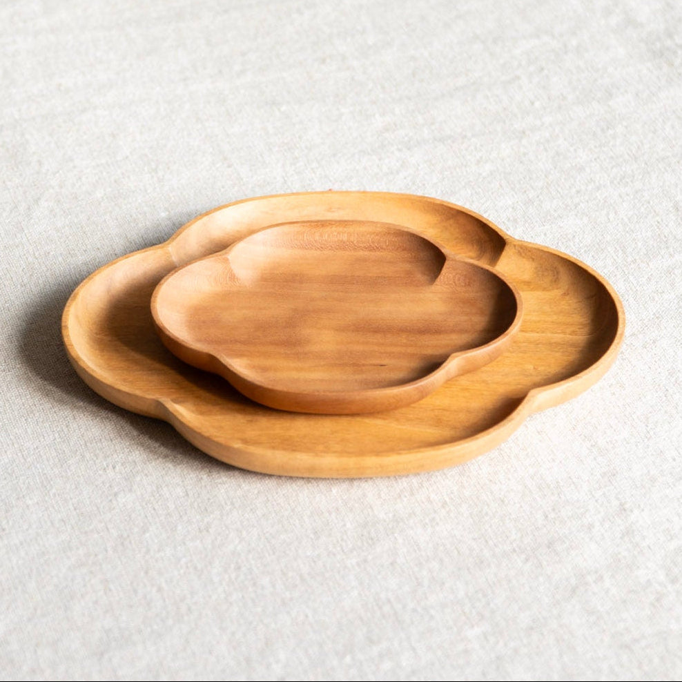 Wooden tray on a textured white surface