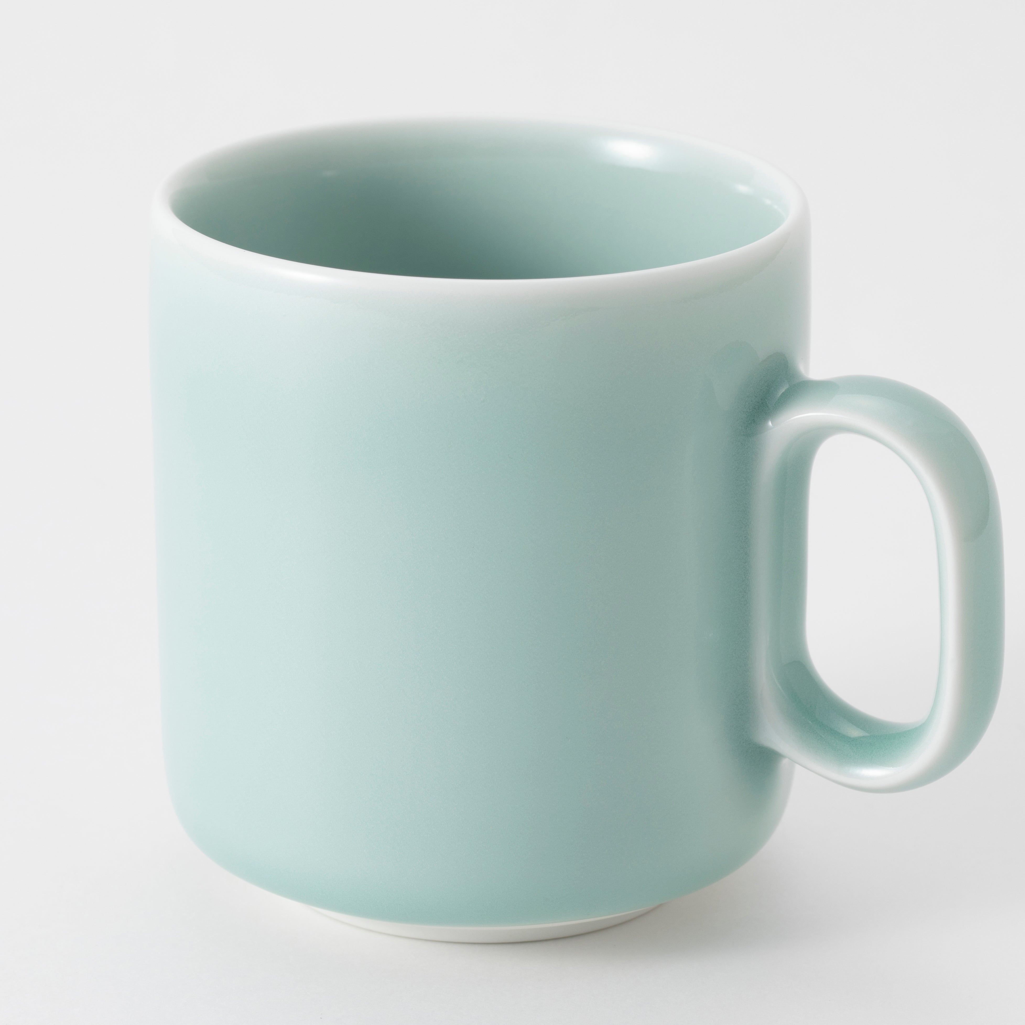 Light blue ceramic mug on a white background
