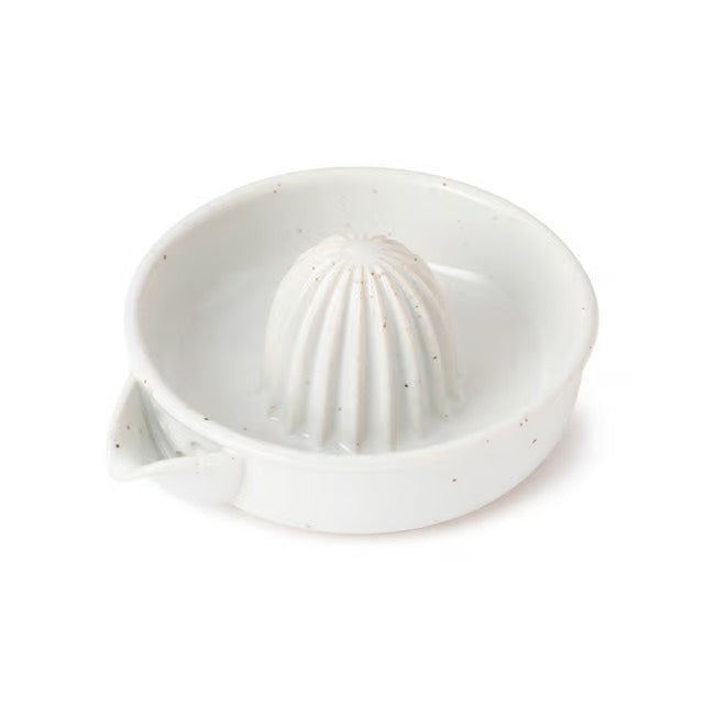 White ceramic citrus press on a white background
