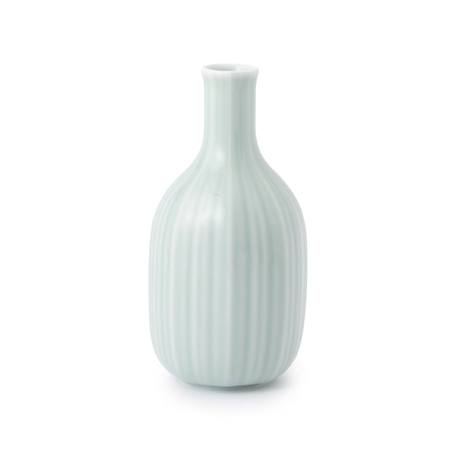 A ceramic sake server by Nabeshima Kosen Kiln with a pale celadon green glaze, featuring a ribbed vertical texture and a short, flared neck, set against a plain white background.
