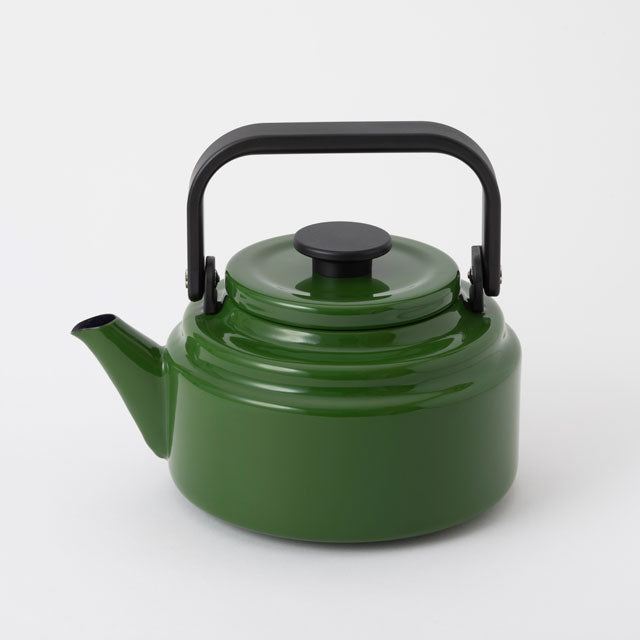 green enamel kettle with black handle