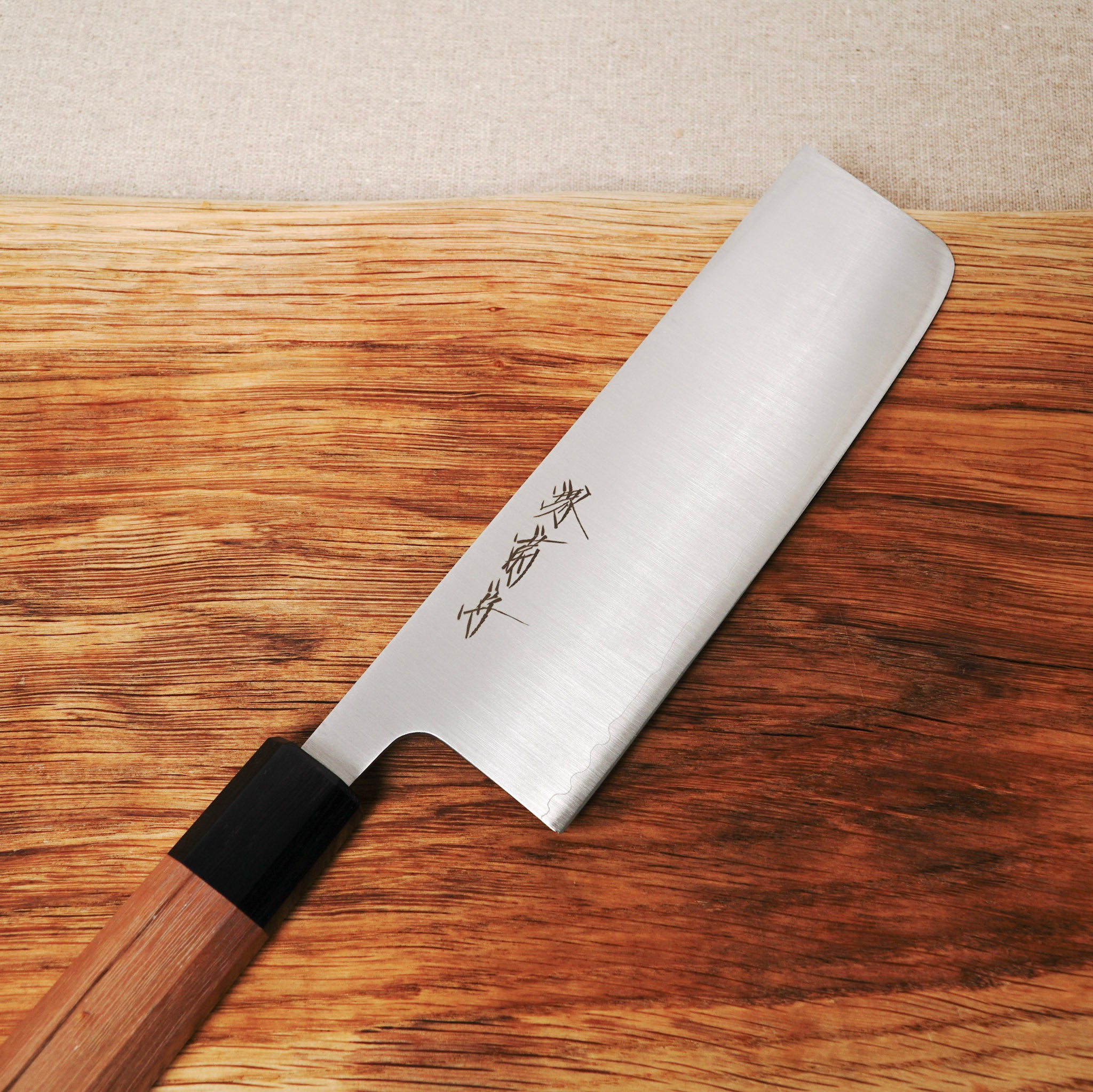 Knife with wooden handle on a wooden surface