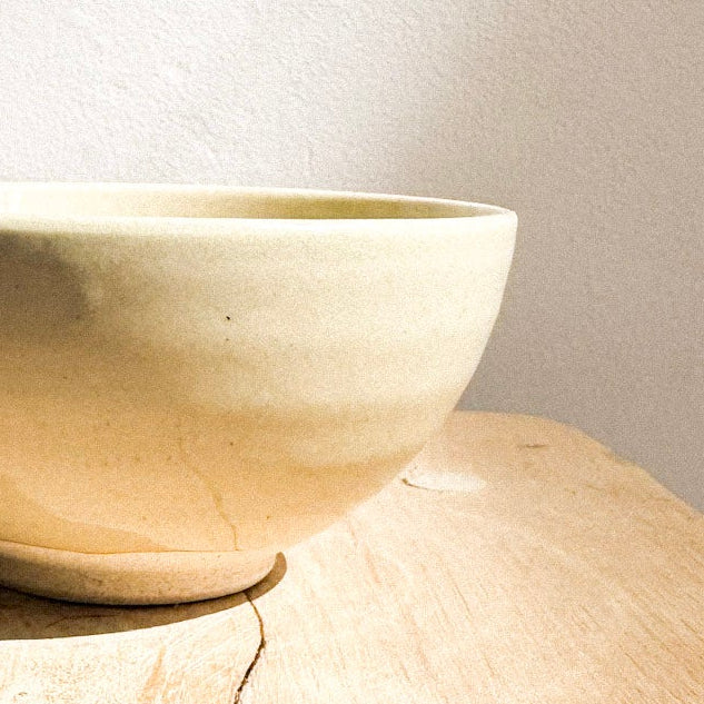light yellow Seto ware bowl by Nakagawa on a wooden surface 